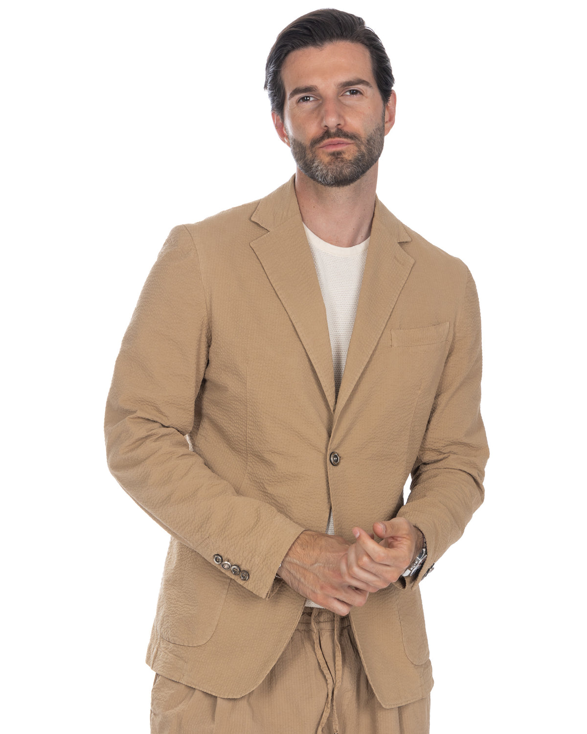 Beige textured cotton seersucker blazer, single-breasted with notch lapels and button cuffs.