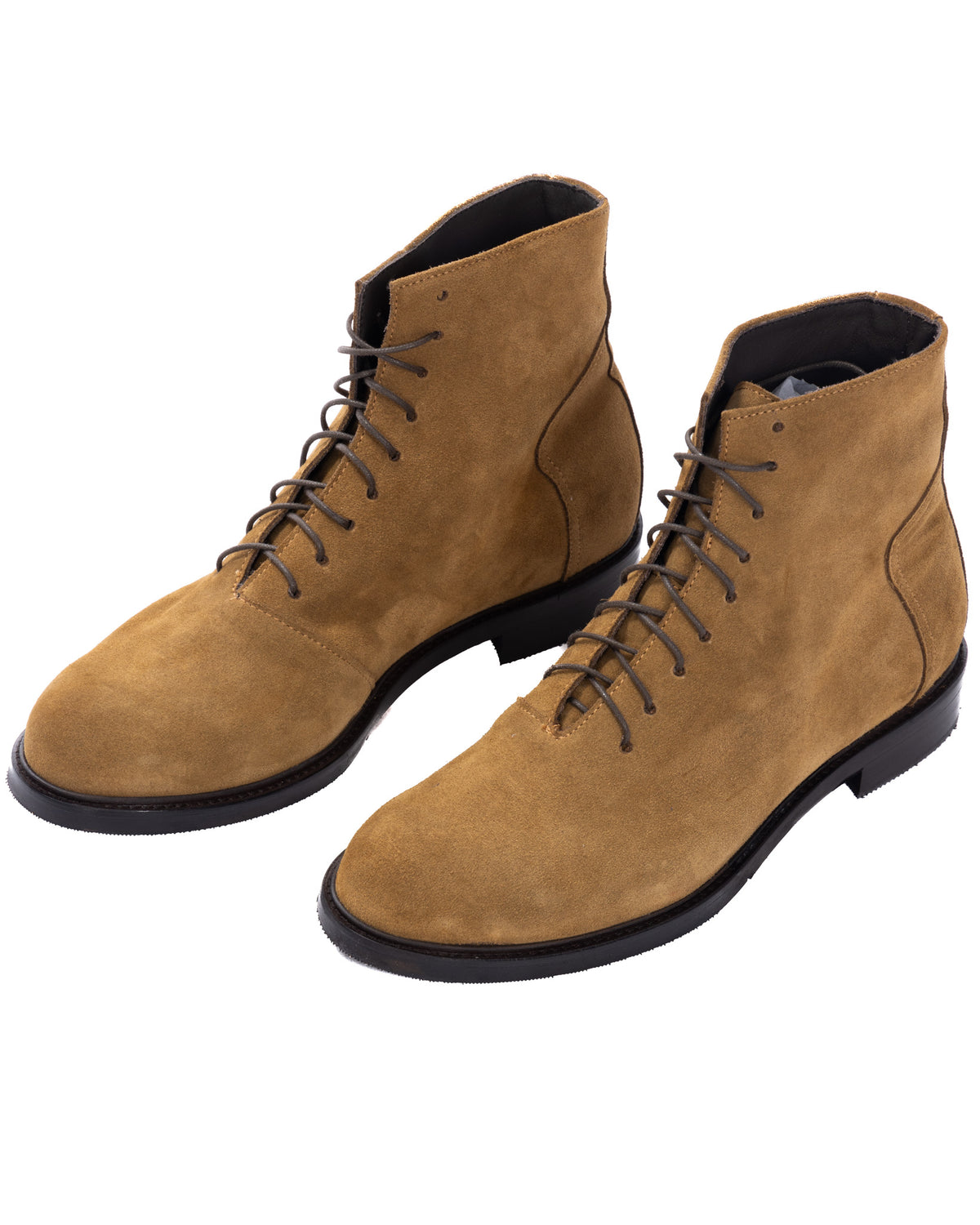 Tan suede lace-up ankle boots with black soles, featuring a sleek minimalist design and round toe.