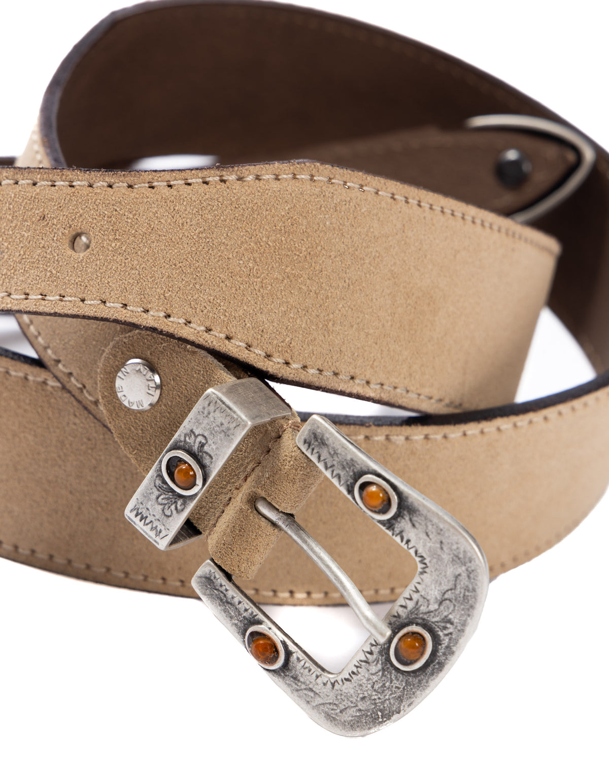 Tan suede leather belt with silver-toned engraved buckle featuring amber stone accents and white contrast stitching.