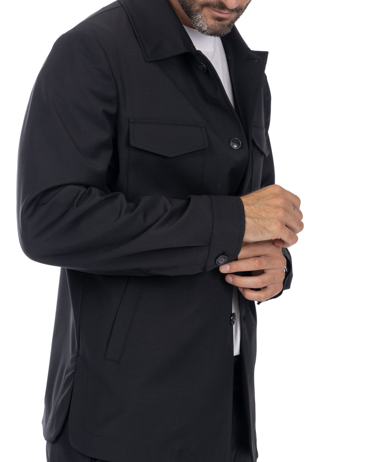 Black button-up jacket with chest pocket, tailored fit, long sleeves with cuff buttons, solid fabric.