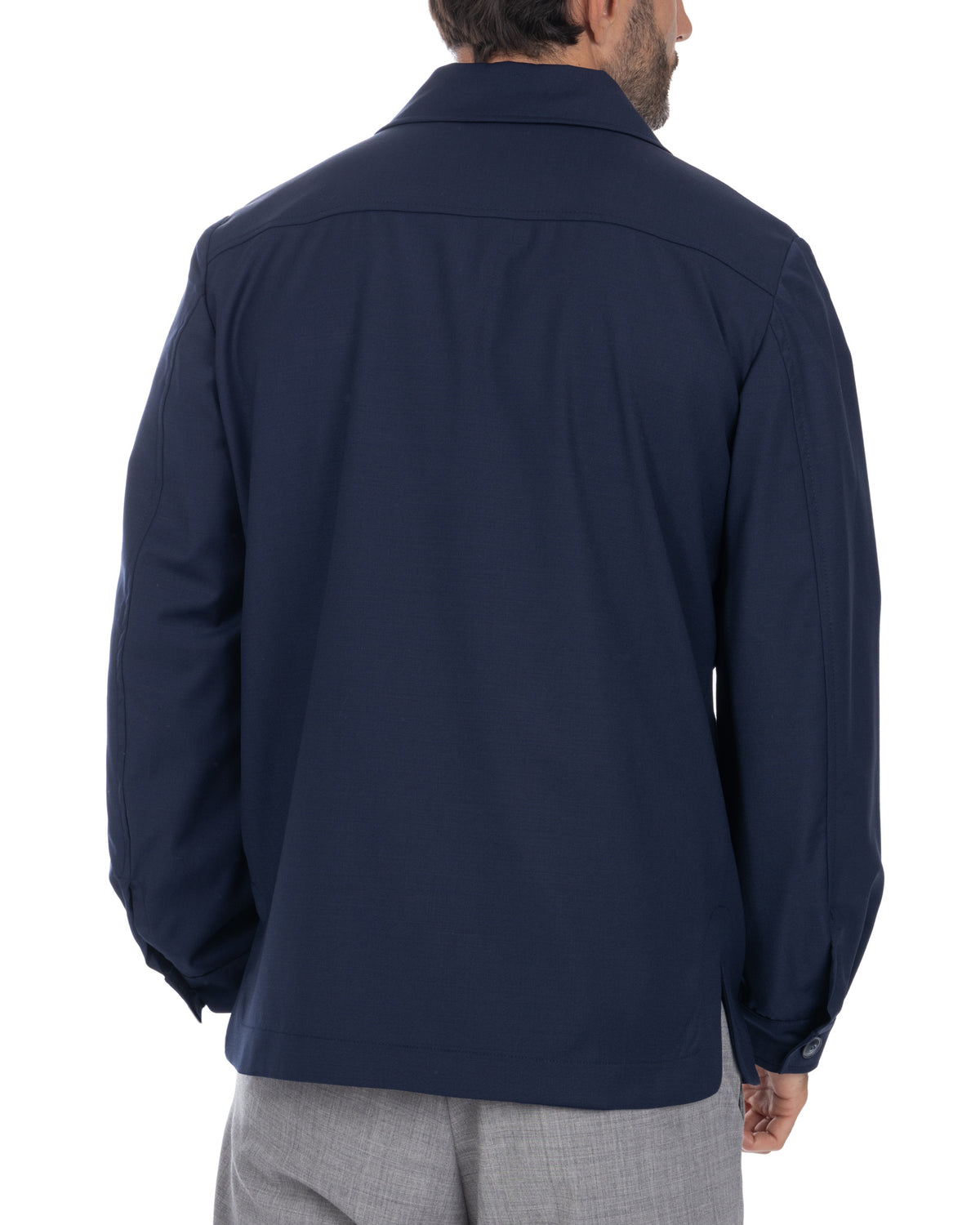 Navy blue men's shirt jacket, long sleeves with button cuffs, back view, lightweight fabric, casual style