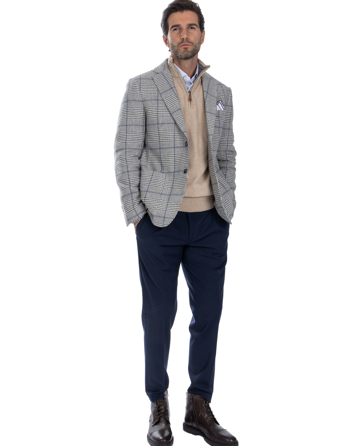 Men's grey plaid wool blazer with beige zip sweater, navy trousers, and brown leather boots - smart casual outfit