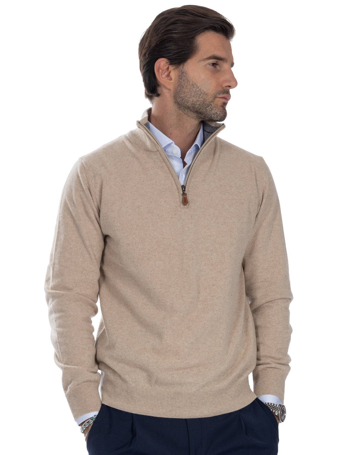 Beige cashmere quarter-zip sweater for men, featuring ribbed collar and cuffs, paired with light blue shirt.