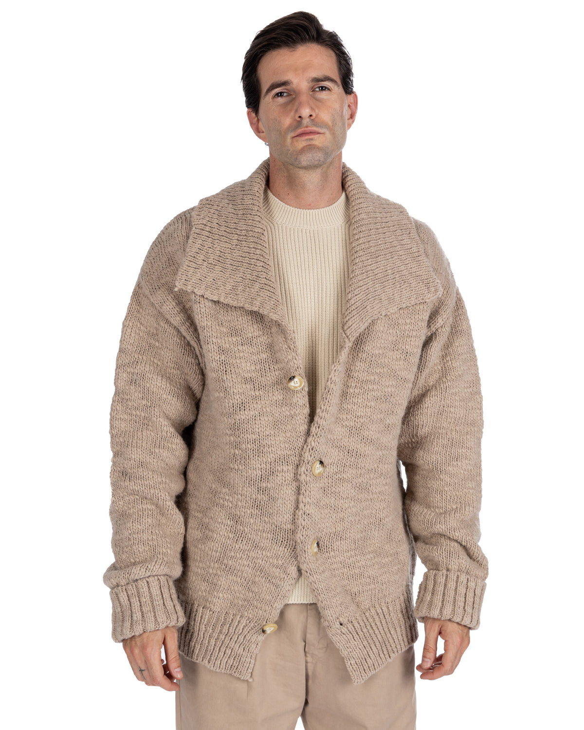 Men's beige chunky knit wool cardigan with shawl collar, button front, and ribbed cuffs.
