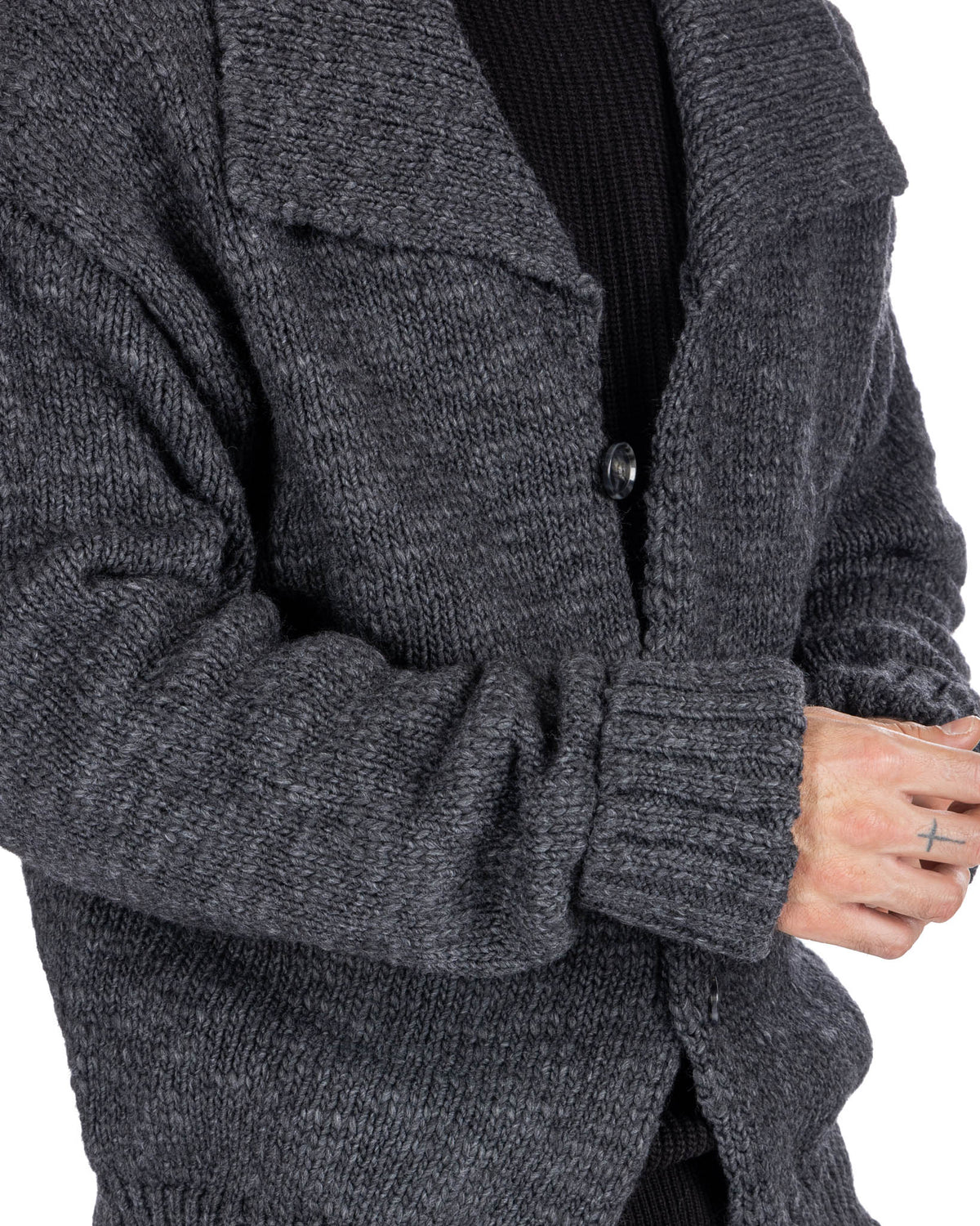 Dark gray chunky knit wool cardigan with notched lapel, button front, and ribbed cuffs.