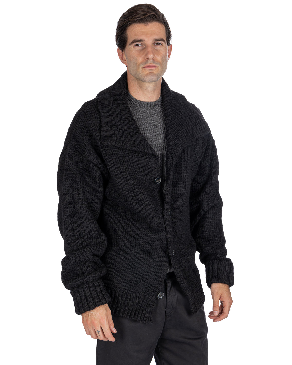 Black chunky knit cardigan for men with shawl collar, button front, and ribbed cuffs. Thick wool blend sweater jacket.