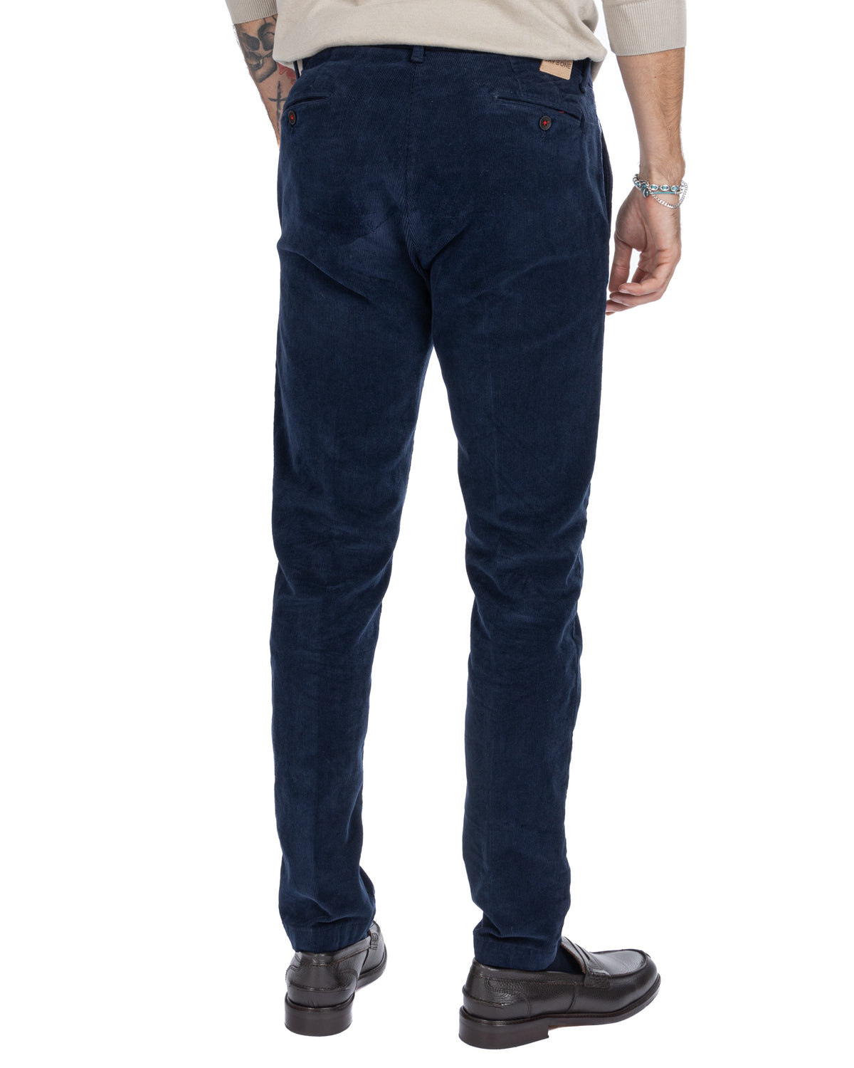 Navy blue corduroy men's pants, slim fit, back pockets with button closure, casual style.