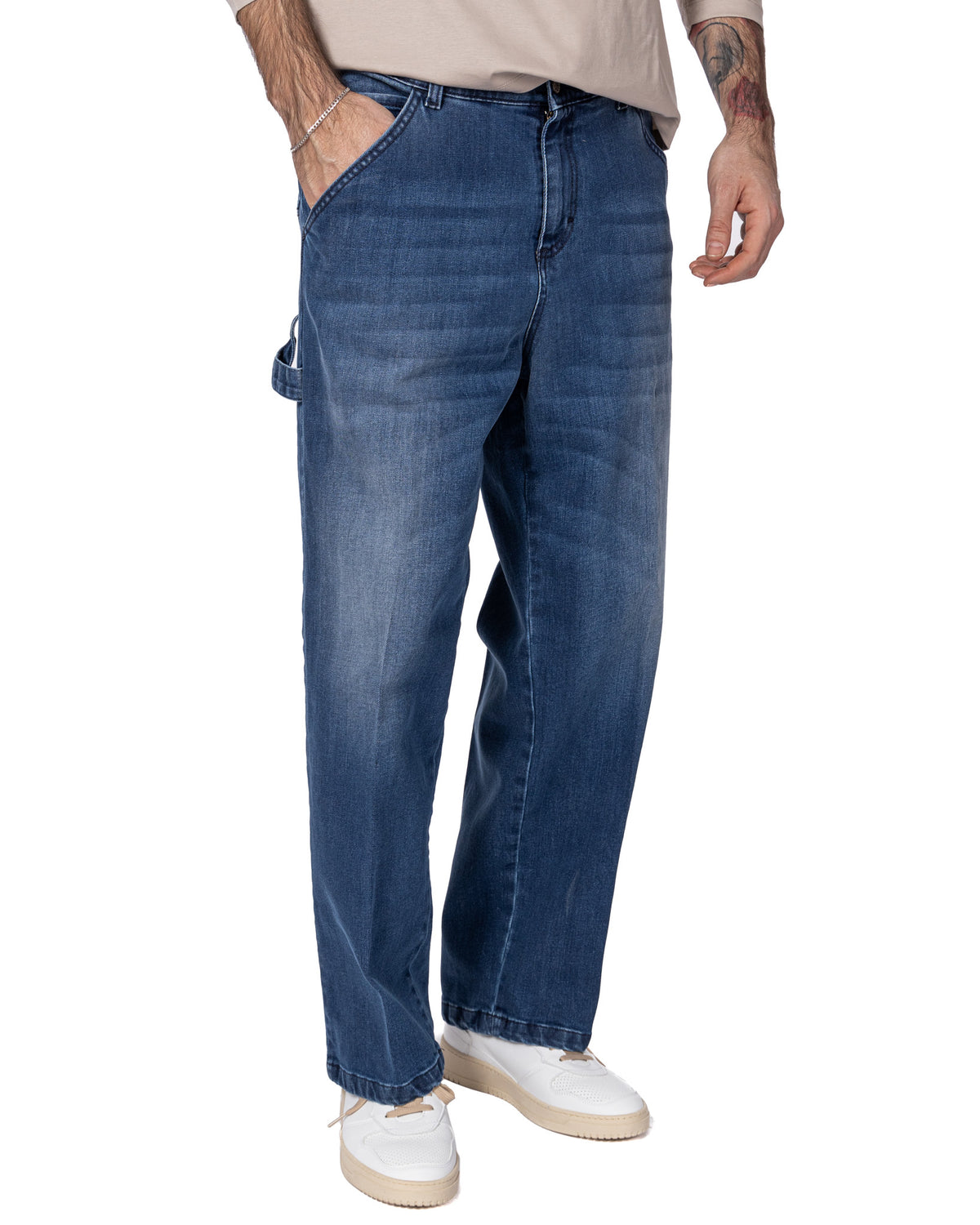 Men's dark blue denim carpenter jeans with straight leg fit, side tool pocket, and faded wash detail.