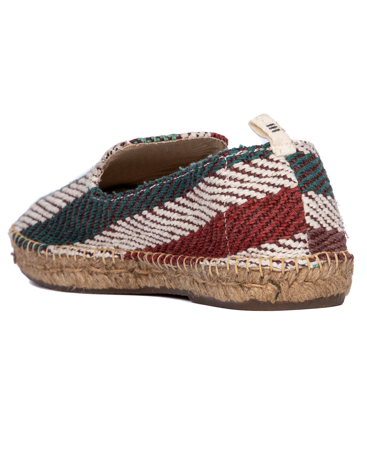 Colorful woven espadrille slip-on shoe with red, teal, and white pattern, jute sole, and canvas heel tab.