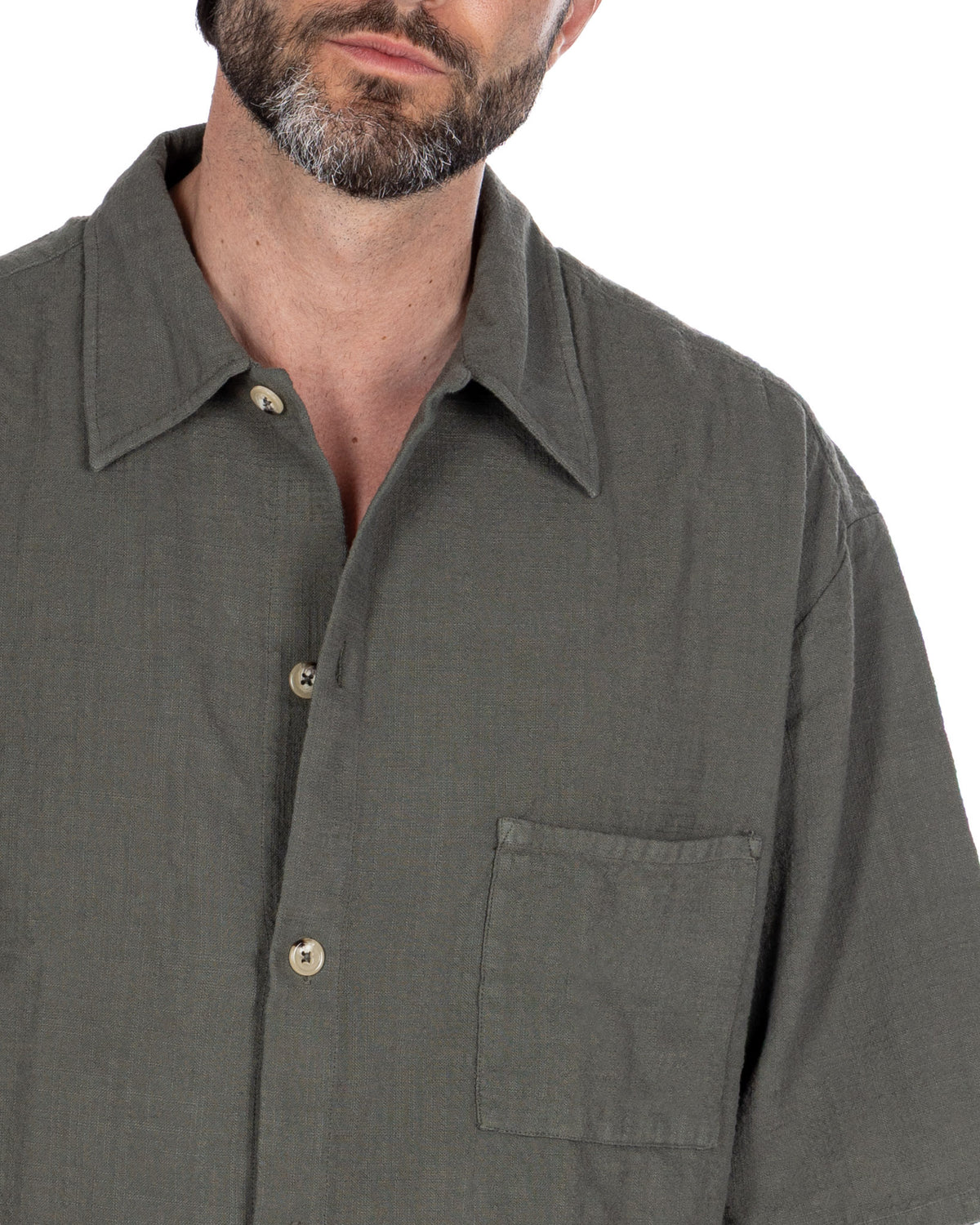 Olive green linen button-down shirt with relaxed fit, chest pocket, and spread collar.