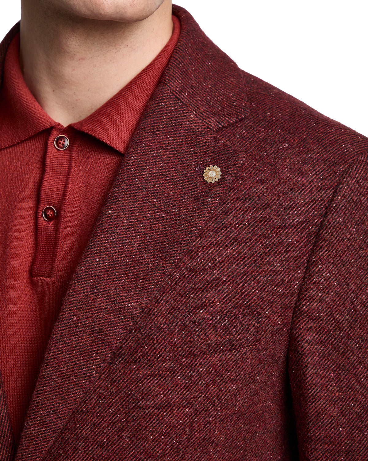 Mens burgundy textured blazer with unique fabric, paired with a matching red polo shirt. Stylish and sophisticated.