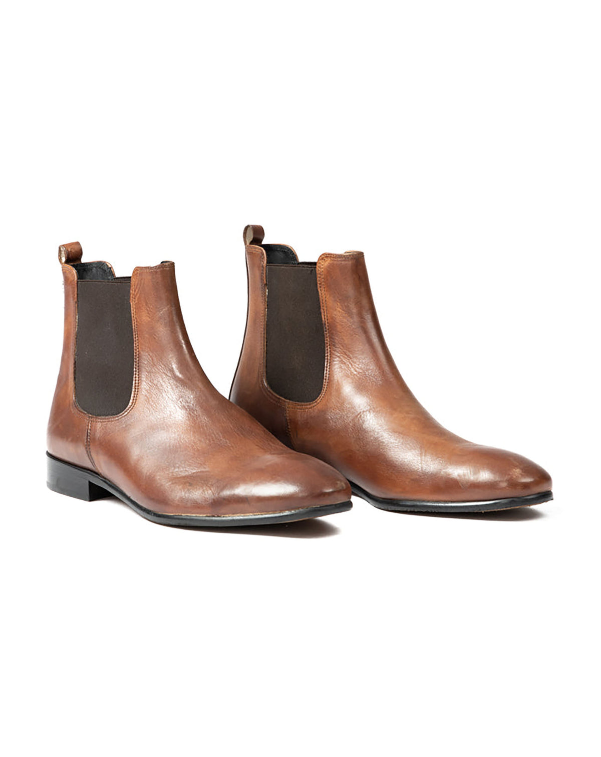 Brown leather Chelsea boots with elastic side panels and sleek silhouette, perfect for smart casual looks.
