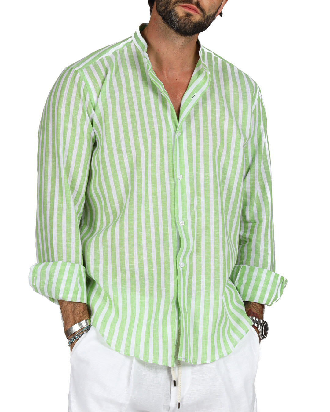 Men's green and white striped linen shirt with rolled-up sleeves, perfect for casual summer outings.
