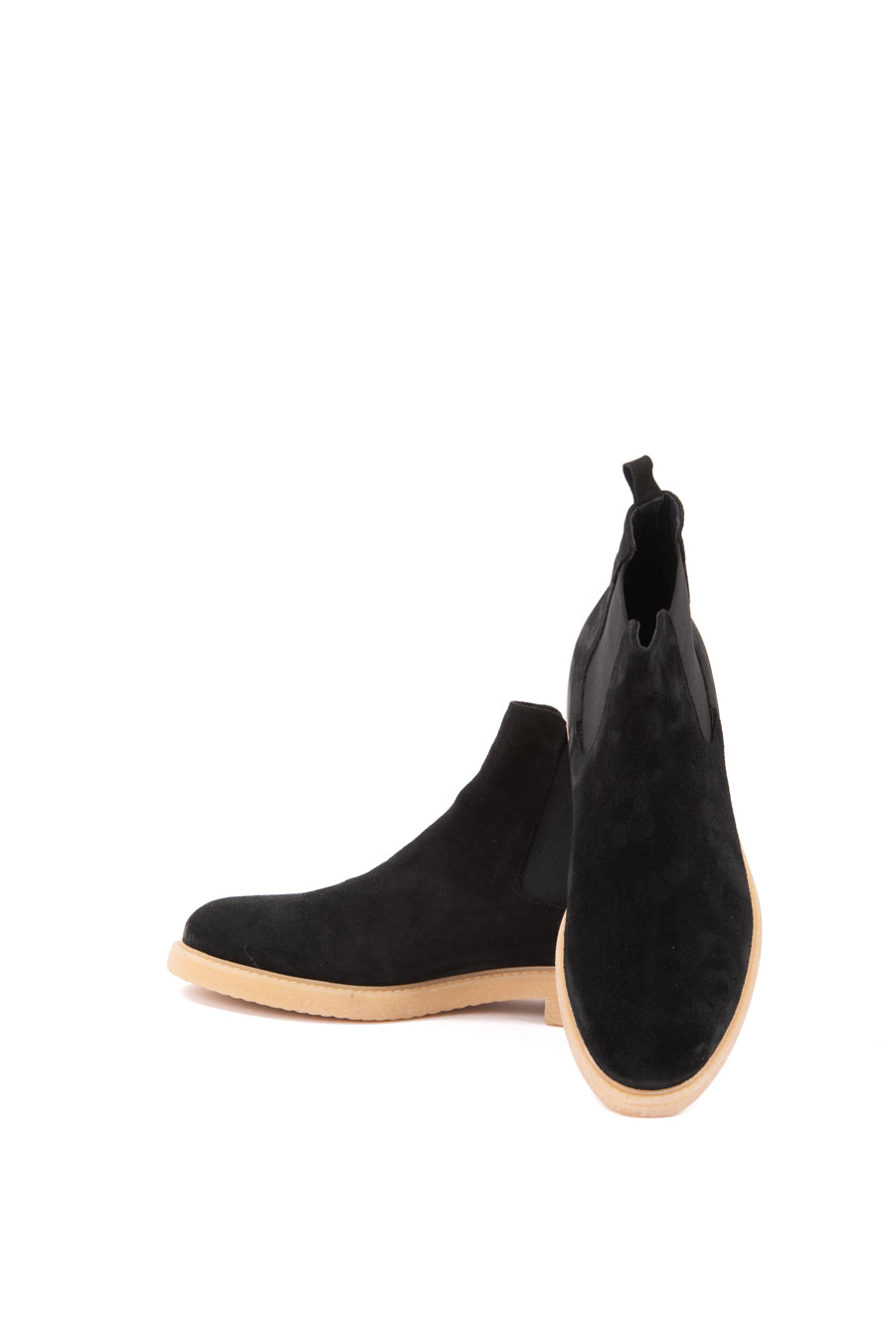 Black suede Chelsea boots with a natural rubber sole, featuring elastic side panels and a sleek, modern design.