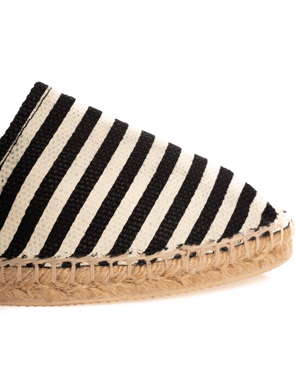 Black and white striped canvas espadrille flat with natural jute rope sole and stitched trim detail.