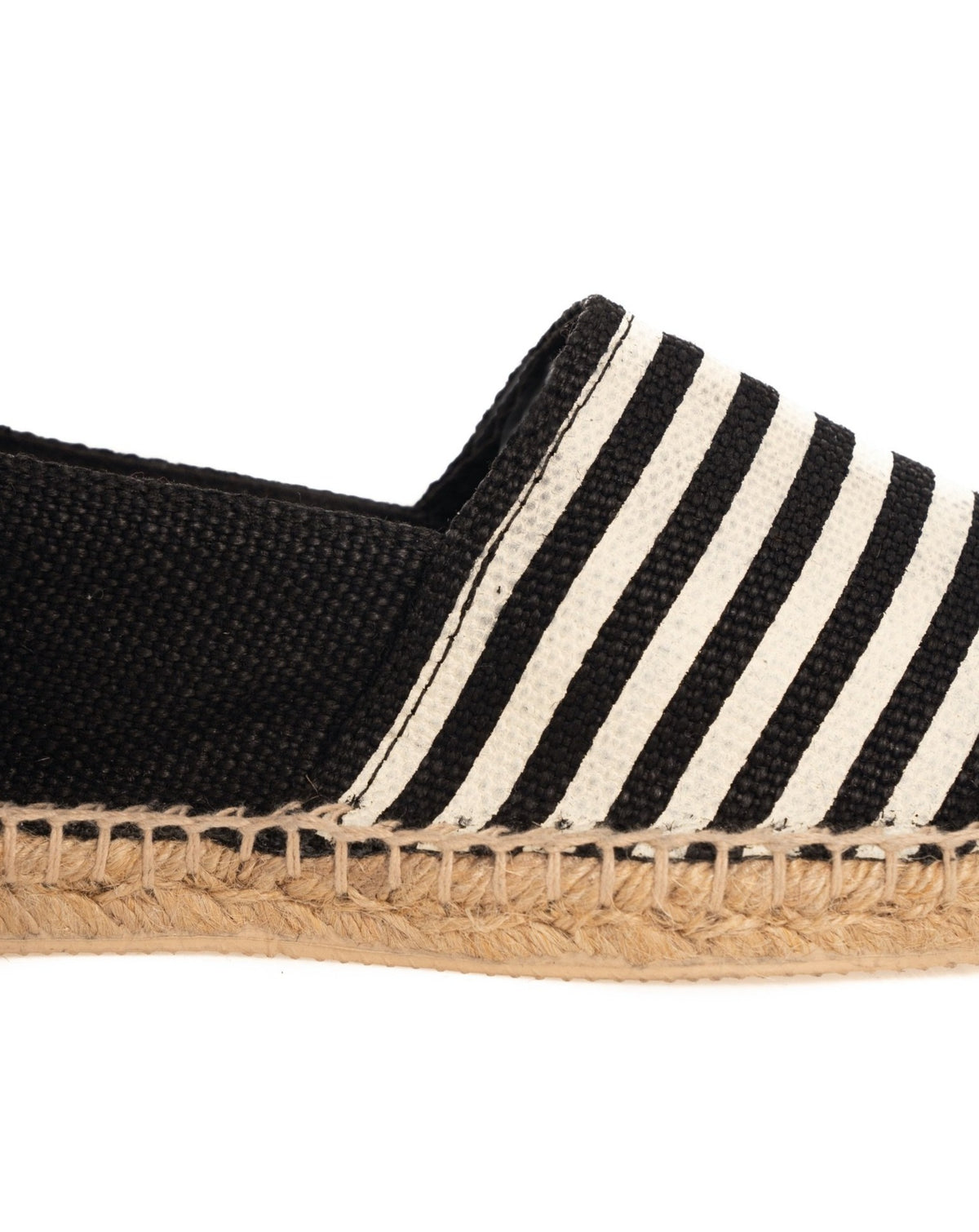 Black and white striped canvas espadrille slip-on shoe with natural jute rope sole detail