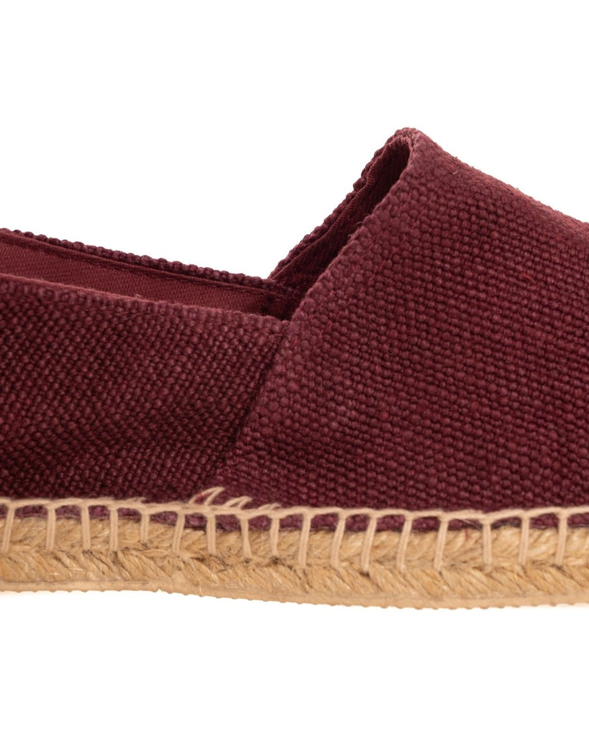 Burgundy canvas espadrille slip-on shoe with woven jute sole and natural rope stitching detail.