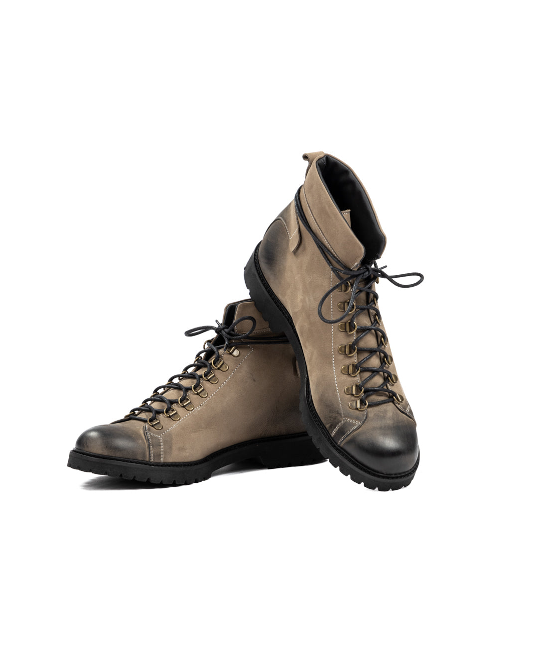 Gray suede leather hiking boots with black toe caps, brass eyelets, and rugged black soles.