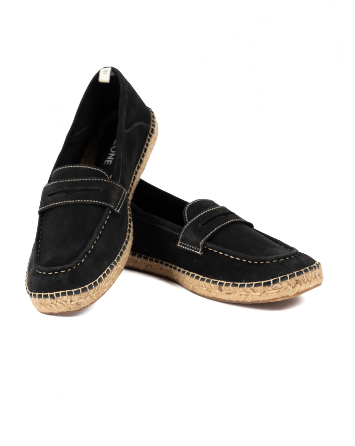 Pair of black suede penny loafer espadrilles with jute soles, shown overlapping on a white background