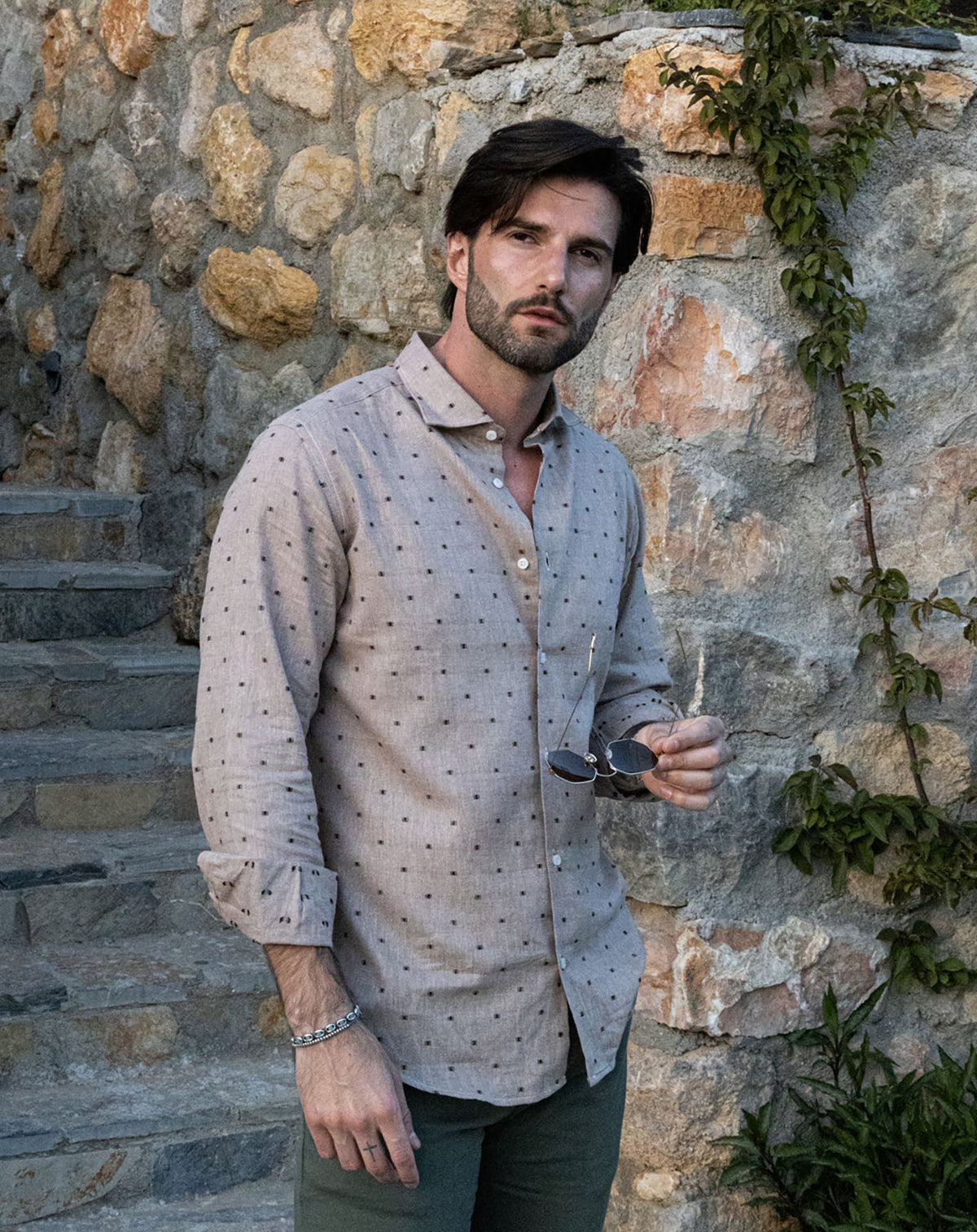 Men's light gray linen button-down shirt with black dot pattern, long sleeves, and relaxed fit for casual summer style.