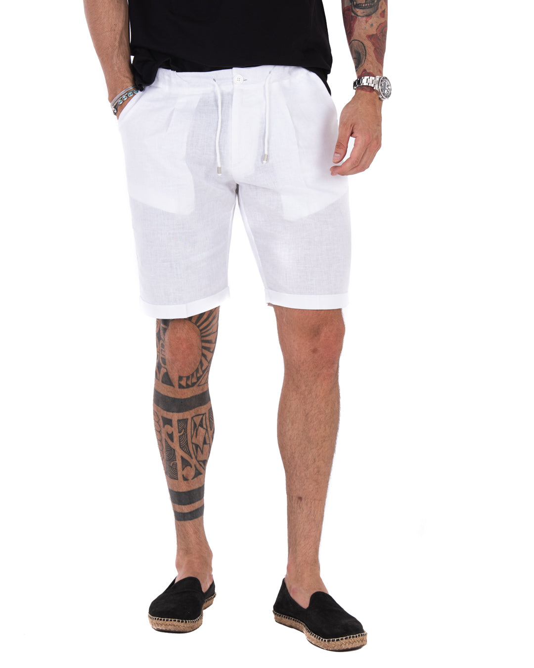 Men's white linen bermuda shorts with drawstring waist and cuffed hems, shown in front view on a model